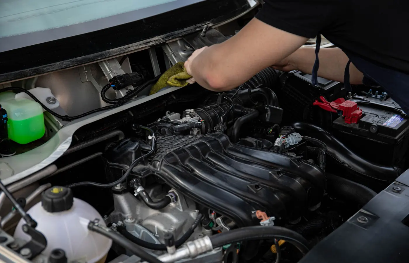 Mechanic inspecting a car engine