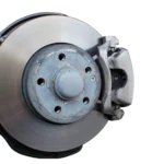 A brake pad wear indicator tab close to the disc surface
