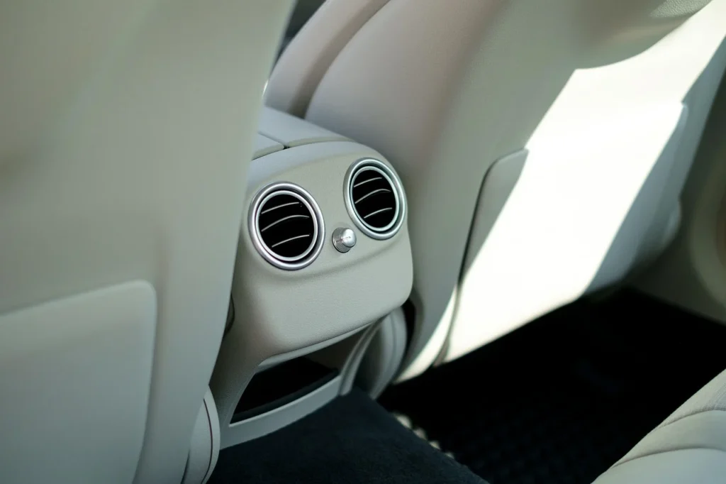 Close up of a car air conditioning vent on the dashboard