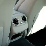 Close up of a car air conditioning vent on the dashboard