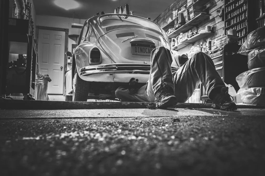 A car clutch and gearbox mount being inspected in a workshop