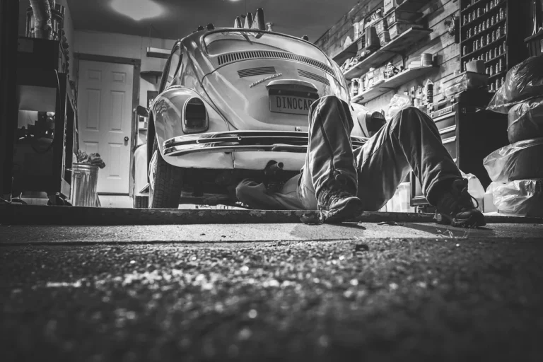 A car clutch and gearbox mount being inspected in a workshop