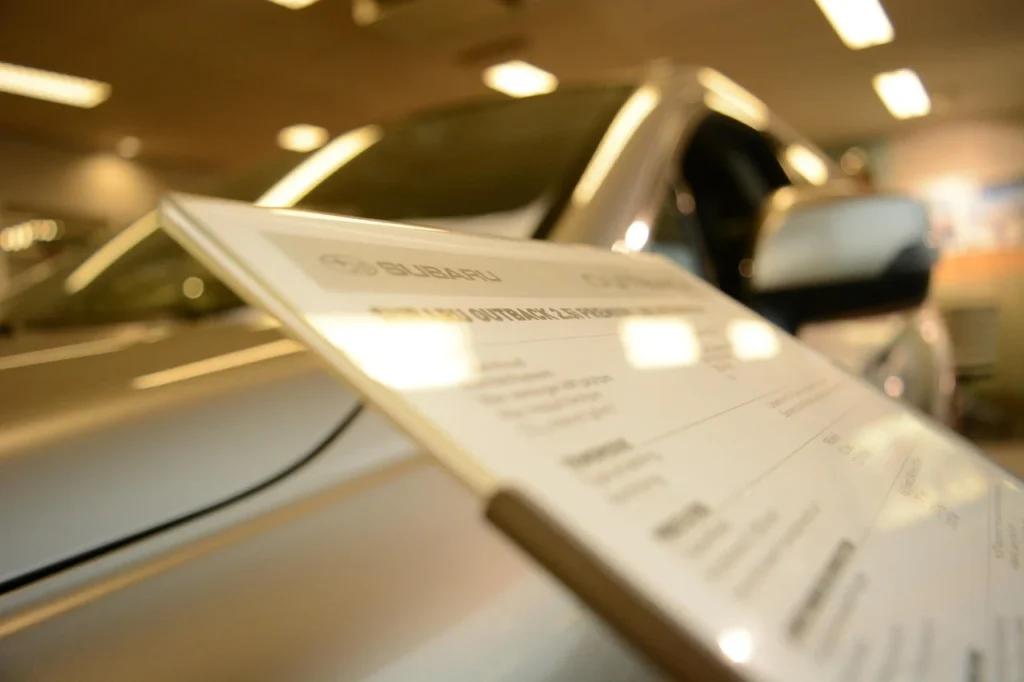 Split comparison of a dealer showroom service desk and a driveway mobile mechanic visit
