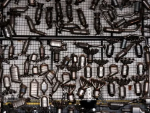 A catalytic converter mounted in the exhaust system underneath a car