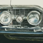 Car headlight being tested for correct beam alignment during an MOT check
