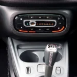 Car heater temperature dial and dashboard controls set to warm