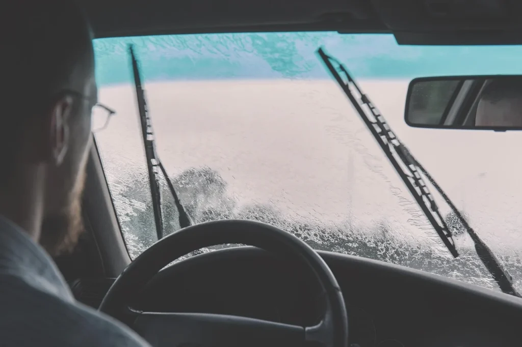 Car windscreen wiper blade working in the rain
