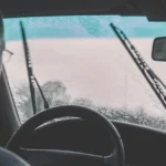 Car windscreen wiper blade working in the rain