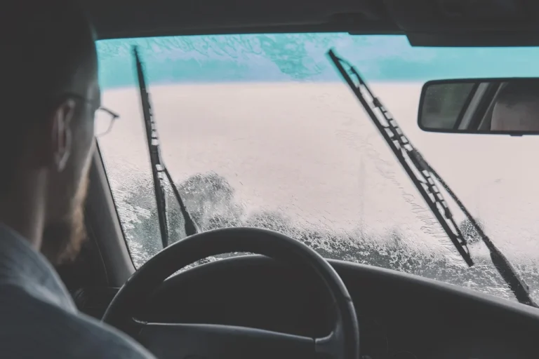 Car windscreen wiper blade working in the rain
