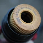 Checking car engine oil with dipstick