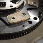 Dual mass flywheel and clutch assembly removed from a car during a repair