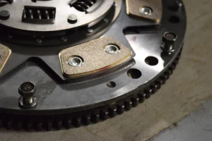 Dual mass flywheel and clutch assembly removed from a car during a repair