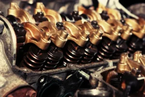 Close up of an EGR valve removed from a diesel engine showing carbon build-up