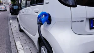 Electric car plugged into a charging station