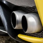Mechanic carrying out an exhaust emissions test using a smoke meter