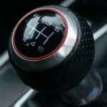 Gear linkage cable and bushing components from a manual transmission
