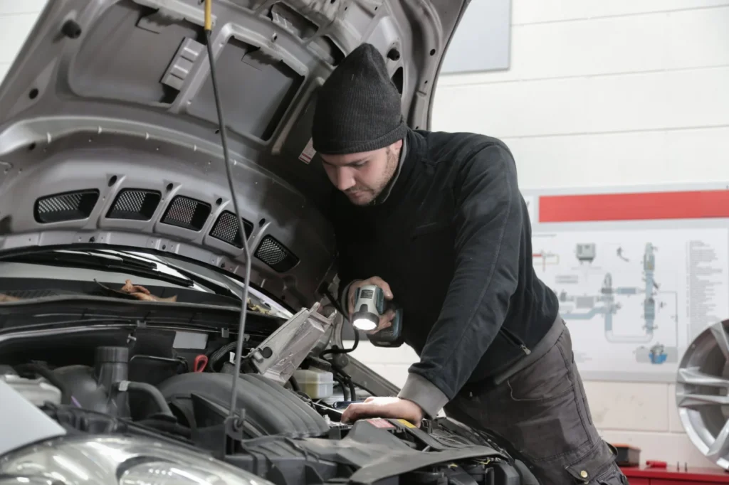 Qualified mobile mechanic carrying out high-voltage EV work at a customer address in West Yorkshire