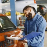 Driver comparing a mobile mechanic quote against a marketplace listing on a laptop
