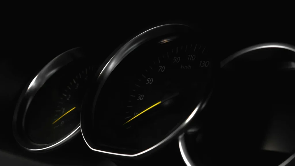 Detailed view of a vehicle speedometer in low light, showcasing speed measurement — SSK Mechanics guide to Audi A1 EPC and Tyre-Pressure Warnings: First Checks