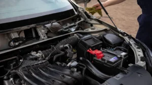 Mechanic inspecting car engine bay and battery during routine maintenance — SSK Mechanics guide to Ford Fiesta Battery Check and Car-Not-Starting Guide