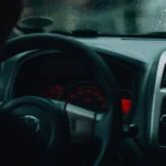 Interior car view with dashboard and raindrops, focusing on driving in rainy conditions — SSK Mechanics guide to Kia Sportage Warning-Light and Diagnostics Guide