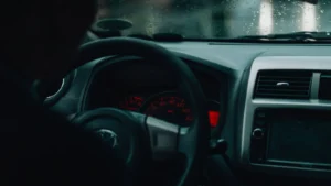 Interior car view with dashboard and raindrops, focusing on driving in rainy conditions — SSK Mechanics guide to Kia Sportage Warning-Light and Diagnostics Guide