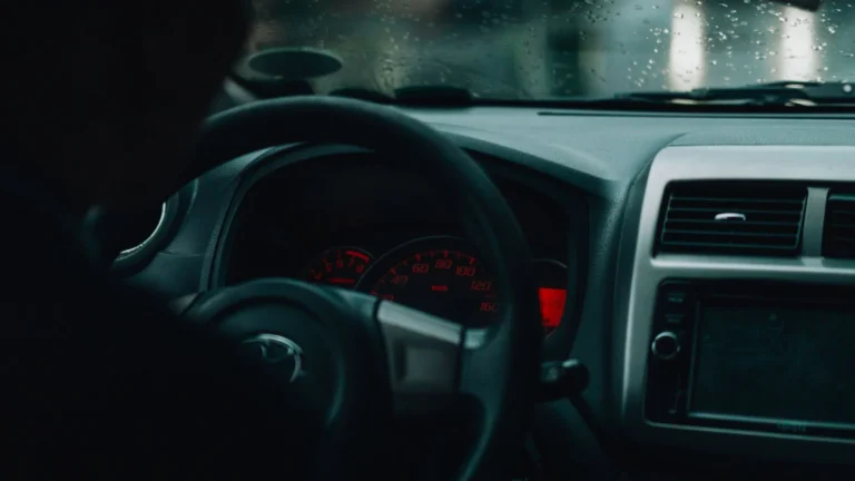 Interior car view with dashboard and raindrops, focusing on driving in rainy conditions — SSK Mechanics guide to Kia Sportage Warning-Light and Diagnostics Guide