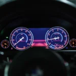 Close-up of a car dashboard with illuminated gauges displaying speed and RPM — SSK Mechanics guide to VW Tiguan Warning-Light and Diagnostics Guide