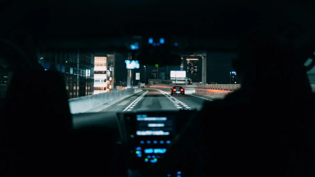 View from inside a car driving on a city highway at night, highlighting urban life — SSK Mechanics guide to Citroën C3 Warning-Light and Diagnostics Guide