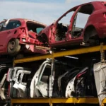 End-of-life vehicle shells stored at a car recycling yard