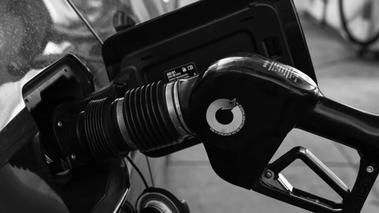 Detailed close-up of a refueling nozzle in monochrome at a gas station, highlighting the petrol… — SSK Mechanics guide to Why Can I Smell Petrol or Diesel Inside or Around My Car