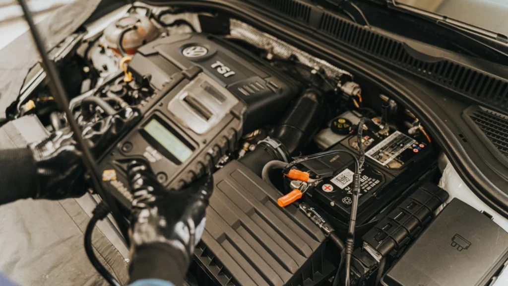 Close-up view of a mechanic diagnosing a Volkswagen engine with specialized equipment — SSK Mechanics guide to Why Does My Engine Cut Out While Driving