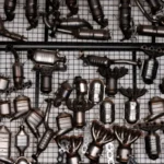 An array of automotive exhaust parts displayed on a grid wall in an industrial garage setting — SSK Mechanics guide to DPF Cleaning Cost vs Replacement: How to Tell Which One You Need