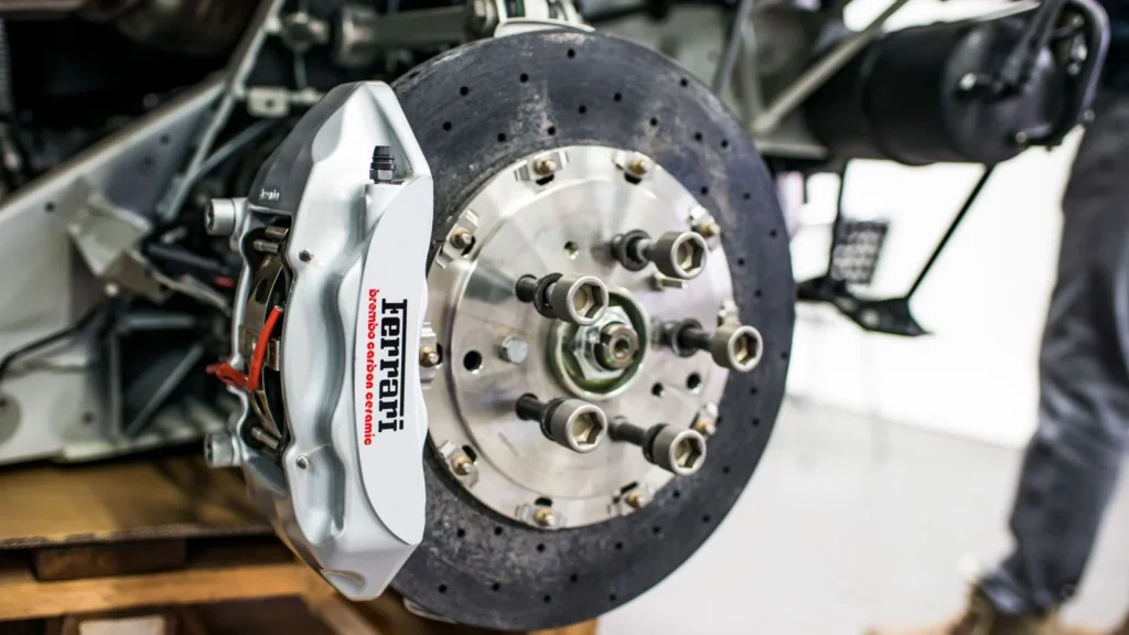Detailed view of disc brake and caliper on a high-performance car, emphasizing precision and… — SSK Mechanics guide to Handbrake / EPB Warning Light: What It Means and Common Causes
