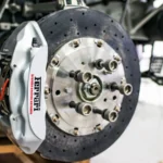 Detailed view of disc brake and caliper on a high-performance car, emphasizing precision and… — SSK Mechanics guide to Handbrake / EPB Warning Light: What It Means and Common Causes