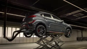 A sleek car on a lift in a high-tech automotive garage — SSK Mechanics guide to AdBlue Warning Light: What It Means and What Happens If You…