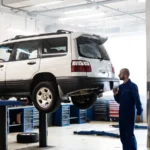 Mechanic inspecting a lifted SUV in a modern auto repair garage — SSK Mechanics guide to How to Check a Car's MOT History Before You Buy It