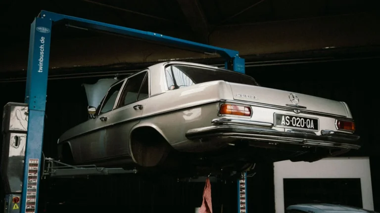 A classic Mercedes-Benz elevated in a car workshop, perfect for automotive themes — SSK Mechanics guide to What Happens After an MOT Fail? Majors, Minors and Dangerous…