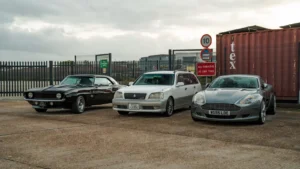 A collection of vintage and modern cars displayed in a UK parking lot, showcasing automotive history — SSK Mechanics guide to Can You Drive Without a Valid MOT? Tax, Insurance and the Law
