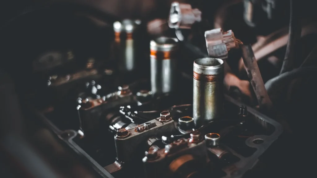 Detailed view of engine parts showcasing camshaft and cylinder head mechanics — SSK Mechanics guide to Spark Plug Wear: The Signs You Need a Replacement