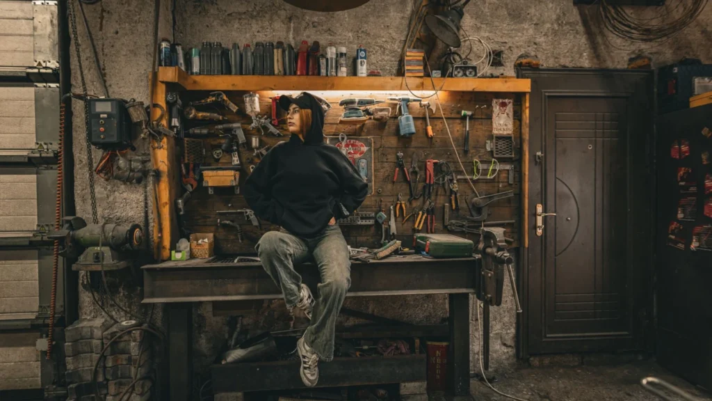 Young adult in an industrial workshop with tools, embracing urban lifestyle — SSK Mechanics guide to Understanding Your MOT: What Gets Checked and How to Prepare