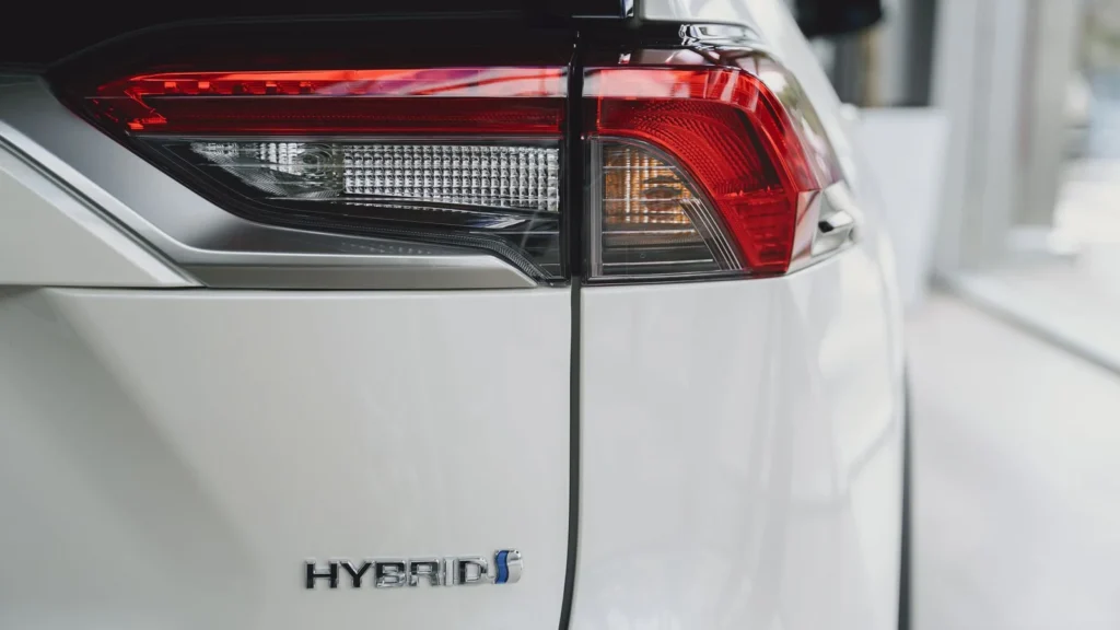 Close-up of a hybrid vehicle badge and rear light — SSK Mechanics guide to what the hybrid battery warning light means