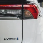 Close-up of a hybrid vehicle badge and rear light — SSK Mechanics guide to what the hybrid battery warning light means