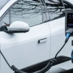Close-up of an electric vehicle charging at a station, showcasing energy-efficient technology — SSK Mechanics guide to The Real Cost of Running an Electric Car vs Petrol