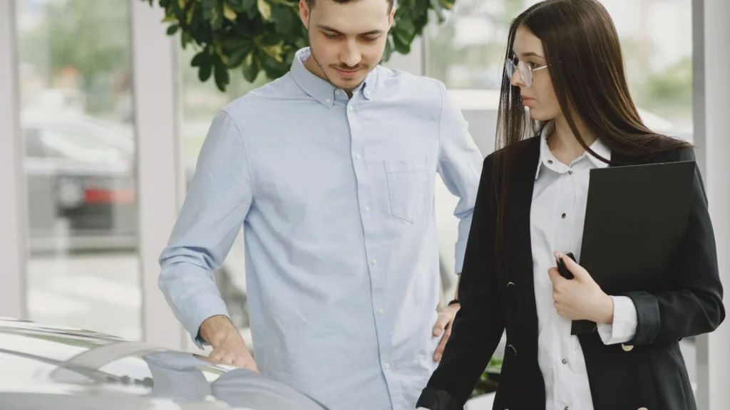 Professional interaction between a client and salesperson in a car dealership setting — SSK Mechanics guide to Buying a Car Privately? Here Are the Red Flags to Watch For
