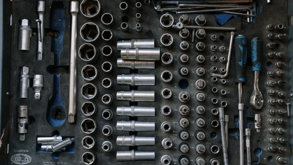 Flat lay of a complete toolset neatly organized in a workshop setting, essential for auto repair… — SSK Mechanics guide to Is a Mobile Mechanic as Good as a Garage