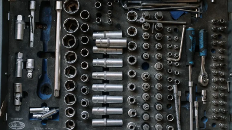 Flat lay of a complete toolset neatly organized in a workshop setting, essential for auto repair… — SSK Mechanics guide to Is a Mobile Mechanic as Good as a Garage