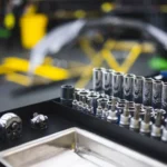 Assorted tools and ratchets arranged in an auto workshop setting — SSK Mechanics guide to Mobile Mechanic Pricing Explained: Labour Costs vs Parts Quotes