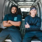 Two men sitting confidently inside an open van, showcasing teamwork and camaraderie — SSK Mechanics guide to How Mobile Servicing Cuts Van Downtime for Tradespeople
