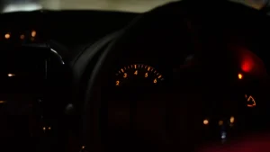 Close-up view of a car dashboard at night, showcasing illuminated gauges and indicators — SSK Mechanics guide to Warning Lights After a Cold Snap or a Bad Pothole: What…